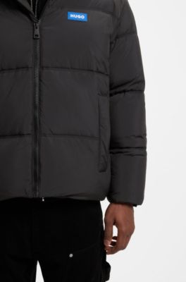 Wasserabweisende Relaxed-Fit Jacke mit Logo-Badge, Schwarz