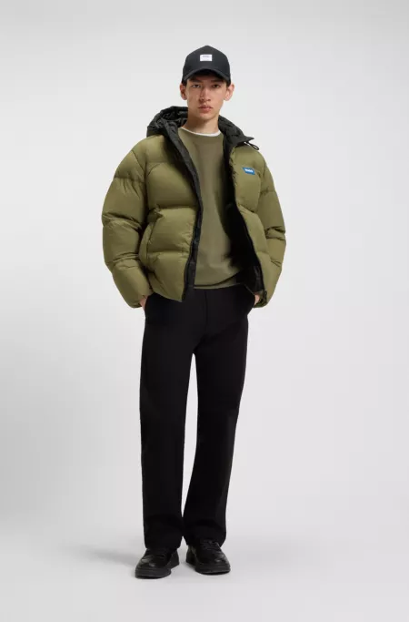 Water-repellent padded jacket with blue logo label