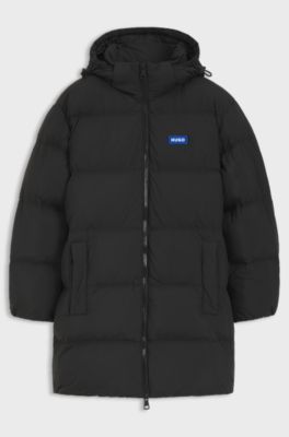 Chaqueta acolchada relaxed fit repelente al agua con capucha ajustable, Negro