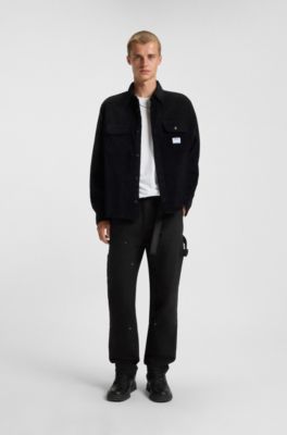 Tapered-fit trousers in cotton canvas, Black