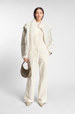 Water-repellent jacket with detachable faux-fur bib, White