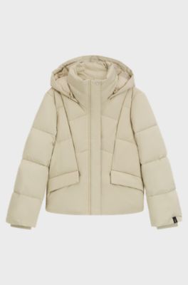 Wattierte Jacke mit Kapuze und Paspeln, Hellbeige