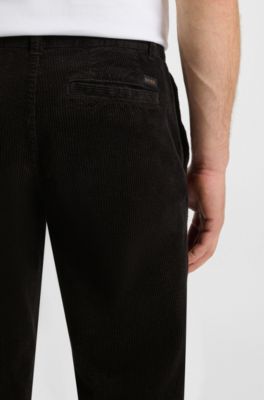 Pantalones tapered fit en pana de algod&oacute;n el&aacute;stico, Negro