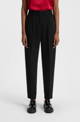 Broek met taps toelopende pijpen en geplooide voorkant, Zwart