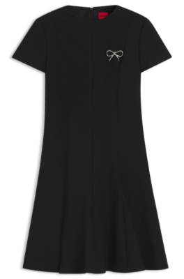 A-line dress with godet inserts and bow brooch 1