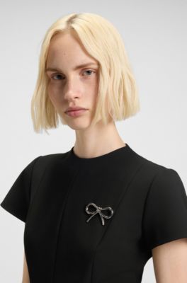 A-line dress with godet inserts and bow brooch, Black