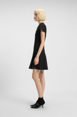 A-line dress with godet inserts and bow brooch, Black