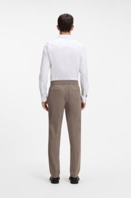 Pantaloni slim fit in flanella elasticizzata m&eacute;lange, Marrone