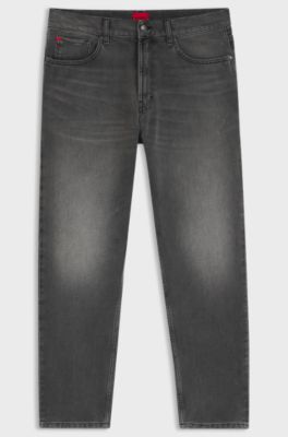 Jeans con fit affusolato in denim grigio con effetti usurati , Grigio