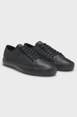 Low-top trainers in grained faux leather, Black