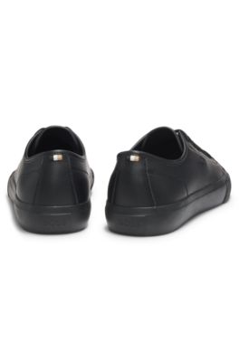 Low-top trainers in grained faux leather, Black