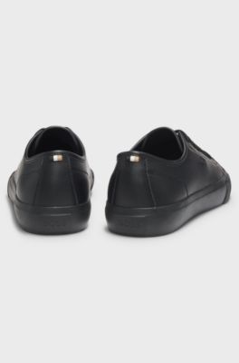 Low-top trainers in grained faux leather, Black