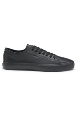 Low-top trainers in grained faux leather, Black