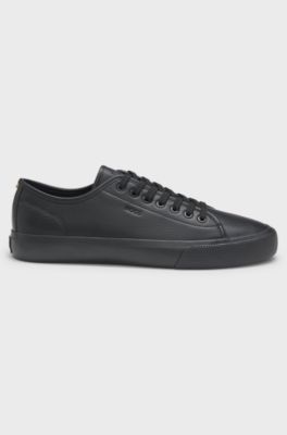 Low-top trainers in grained faux leather, Black