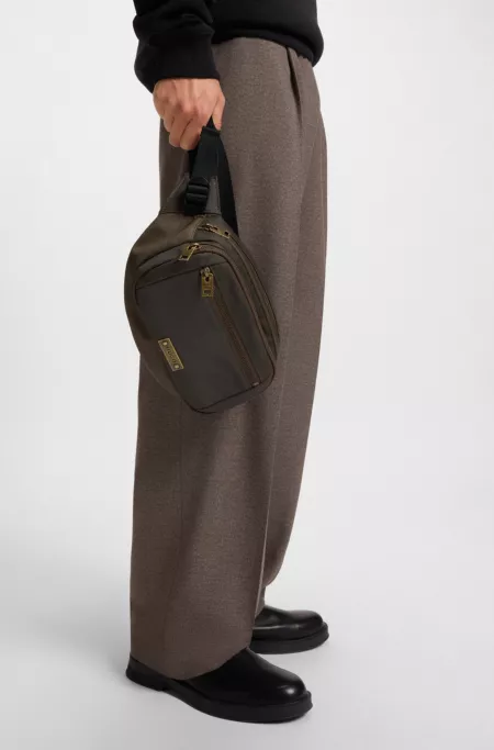 Belt bag with antique-effect logo plaque