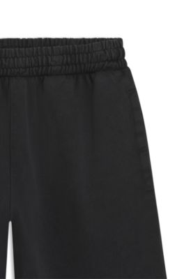 Tracksuit-bukser i sweatstof af bomuld med rhinstenslogo, Sort