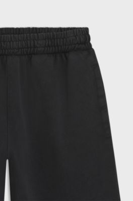 Cotton-terry tracksuit bottoms with rhinestone logo, Black