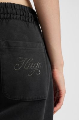 Cotton-terry tracksuit bottoms with rhinestone logo, Black