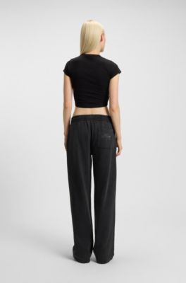 Cotton-terry tracksuit bottoms with rhinestone logo, Black