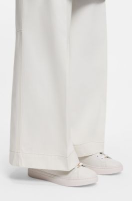 Leather trainers with embossed logos, White