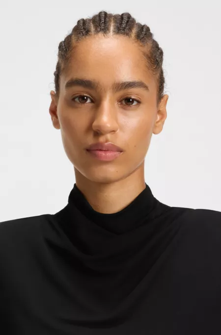 Jersey dress with feathered plissé pleats