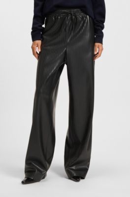 Pantaloni relaxed fit a gamba larga in similpelle a righe, Nero