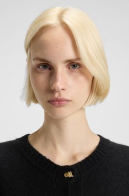 Gebreid vest met goudkleurige geknoopte knopen, Zwart