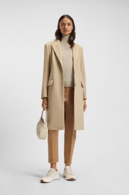 Rollkragenpullover aus Merinowolle, Hellbeige