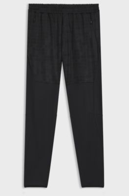 Active tracksuit bottoms in graphic-print performance fabric, Dark Blue