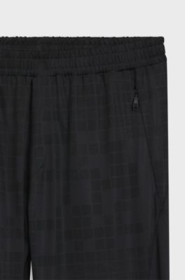 Active tracksuit bottoms in graphic-print performance fabric, Dark Blue
