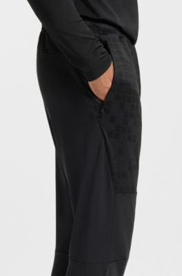 Active tracksuit bottoms in graphic-print performance fabric, Dark Blue