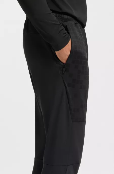 Active tracksuit bottoms in graphic-print performance fabric