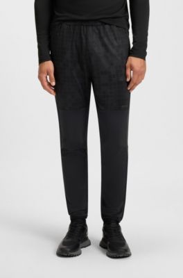 Active tracksuit bottoms in graphic-print performance fabric, Dark Blue