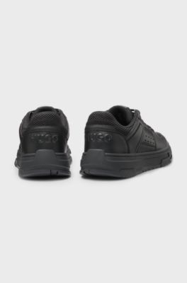 Imitatieleren sneakers met mesh decoraties, Zwart