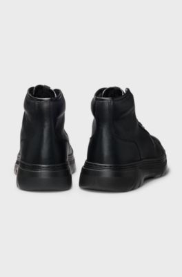 High-top boots in grained leather, Black