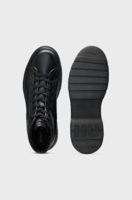 High-top boots in grained leather, Black