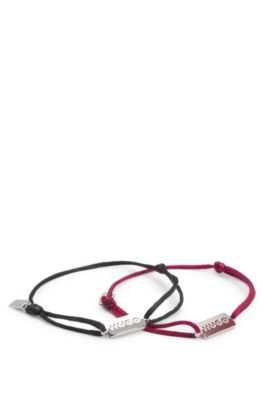 Two cord cuffs with split-logo plaques, Multicoloured