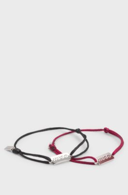 Two cord cuffs with split-logo plaques, Multicoloured