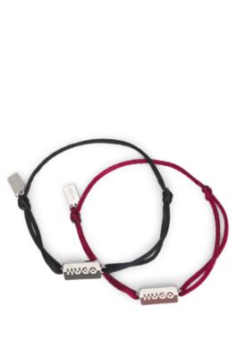 Two cord cuffs with split-logo plaques, Multicoloured