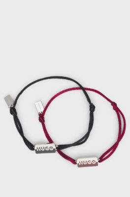 Two cord cuffs with split-logo plaques, Multicoloured