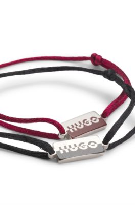Two cord cuffs with split-logo plaques, Multicoloured