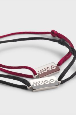 Two cord cuffs with split-logo plaques, Multicoloured