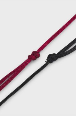 Two cord cuffs with split-logo plaques, Multicoloured