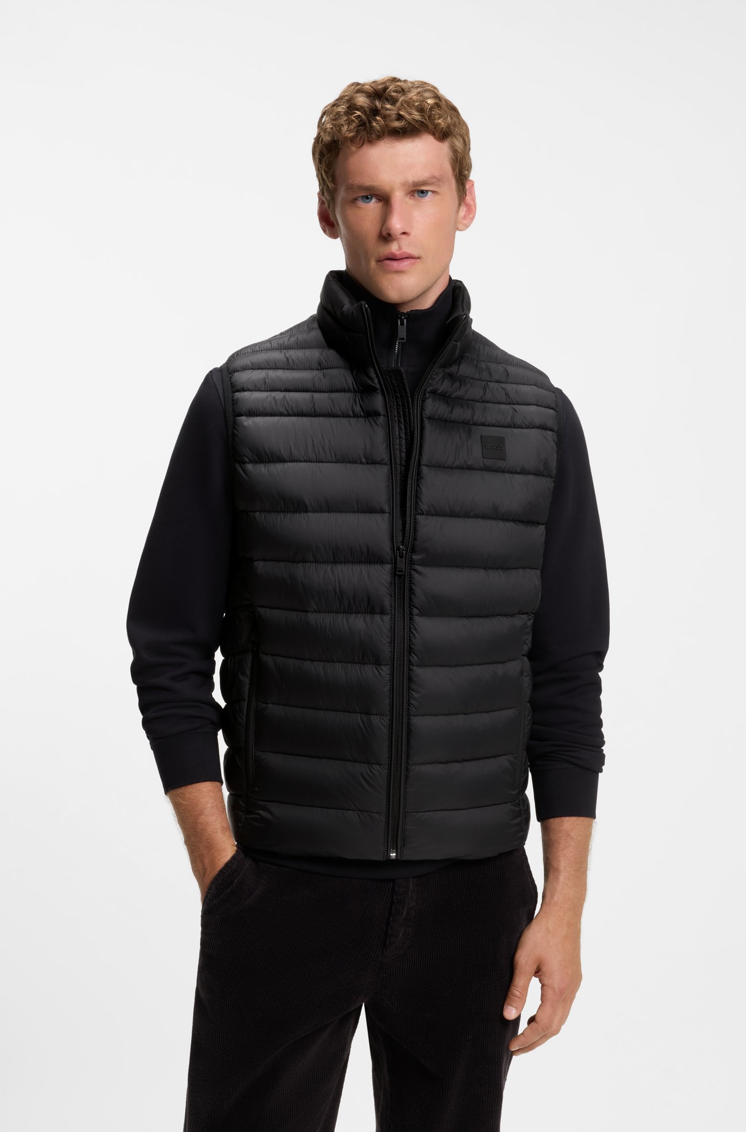 Water-repellent gilet with logo patch