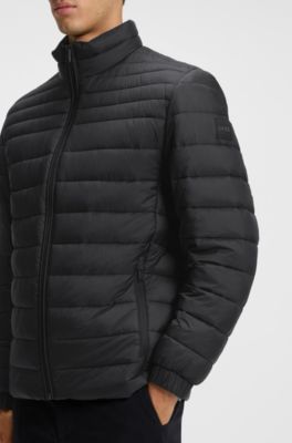 Opbergbaar waterafstotend gewatteerd jack met logopatch, Zwart