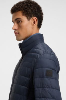 Veste matelass&eacute;e d&eacute;perlante et compressible avec &eacute;tiquette logot&eacute;e, Bleu fonc&eacute;