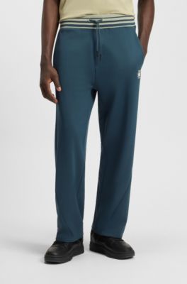 HUGO x RB oversized-fit tracksuit bottoms with striped waistband, Dark Blue