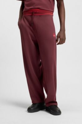 HUGO x RB oversized-fit tracksuit bottoms with striped waistband, Dark Red