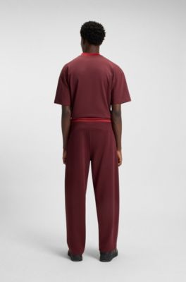 HUGO x RB oversized-fit tracksuit bottoms with striped waistband, Dark Red
