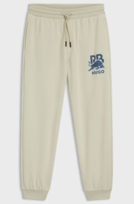 HUGO x RB cotton-terry tracksuit bottoms with bull graphic, Light Beige